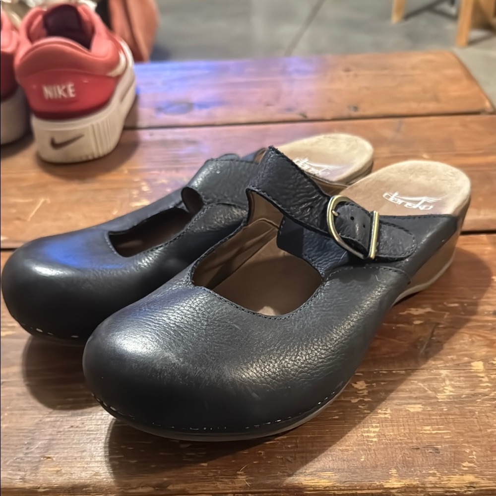 Dansko Black Leather Mules with Buckle Closure